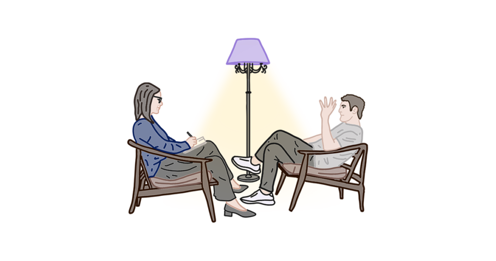 Дві людини сидять у кріслах, між ними торшер